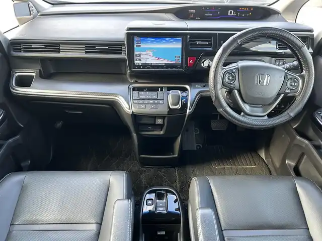 ホンダ ステップワゴン スパーダ ハイブリッド G EX ホンダセンシング 島根県 2017(平29)年 15.7万km 黒 登録時走行距離157745km/純正9インチナビ（BT/TV/CD/DVD/FM/AM）/クルーズコントロール/ドライブレコーダー（前のみ）/両側パワースライドドア/前席シートヒーター/コーナーセンサー（前後）/純正アルミホイール/純正フロアマット/LEDヘッドライト/プッシュスタート/衝突軽減装置/横滑り防止装置