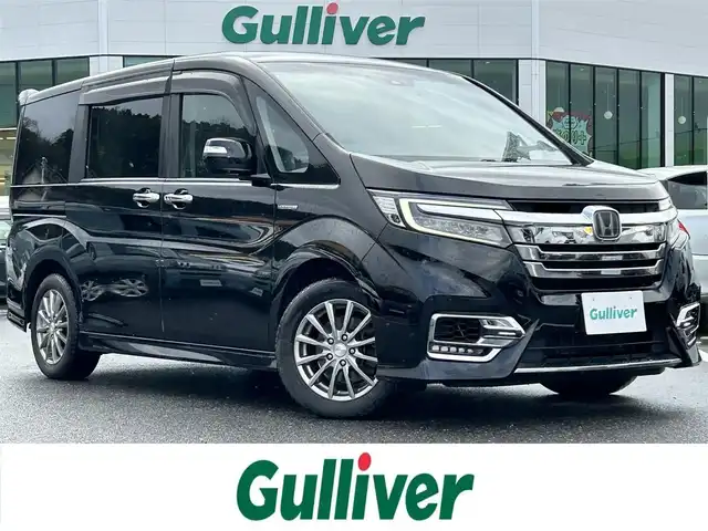 ホンダ ステップワゴン スパーダ ハイブリッド G EX ホンダセンシング 島根県 2017(平29)年 15.7万km 黒 登録時走行距離157745km/純正9インチナビ（BT/TV/CD/DVD/FM/AM）/クルーズコントロール/ドライブレコーダー（前のみ）/両側パワースライドドア/前席シートヒーター/コーナーセンサー（前後）/純正アルミホイール/純正フロアマット/LEDヘッドライト/プッシュスタート/衝突軽減装置/横滑り防止装置