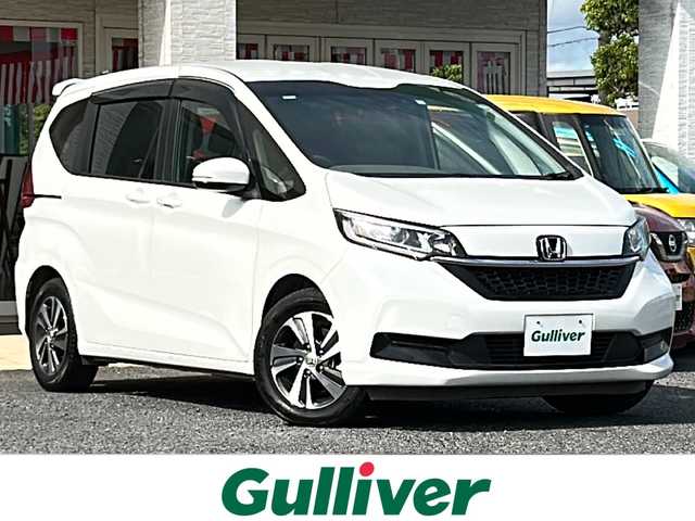 ホンダ フリード ハイブリット G 千葉県 2022(令4)年 5万km プラチナホワイトパール レーダークルーズ　レーンアシスト　ホンダセンシング　シートヒーター　両側パワースライドドア　ドラレコ　純正１５インチＡＷ　オートライト　ＬＥＤライト　バックセンサー　リアスポイラー　スマートキー