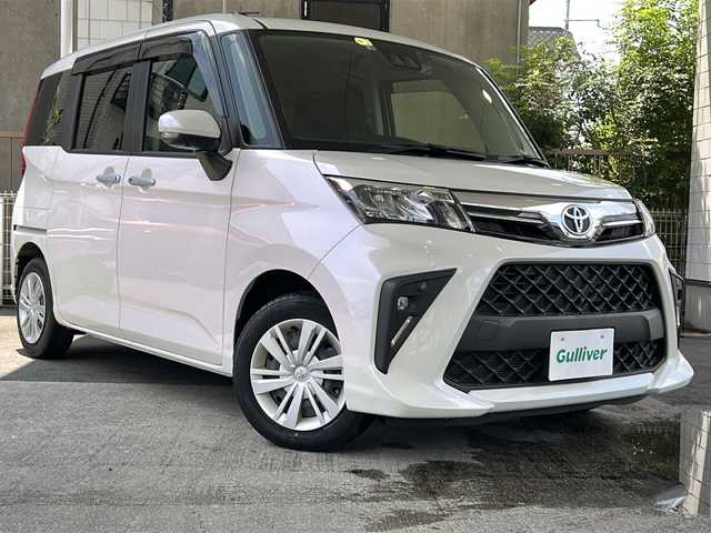 トヨタ ルーミー G 京都府 2022(令4)年 0.2万km パールホワイトⅢ ワンオーナー車/純正SDナビ/・Bluetooth Audio/・CD/・ワンセグTV/・USB/バックカメラ/パノラミックビューモニター/アイドリングストップ/前後ドライブレコーダー/スマートアシスト/・衝突警報機能/・衝突回避支援ブレーキ機能/・ブレーキ制御付誤発進抑制機能/・車線逸脱警報機能/・路側逸脱警報機能/・ふらつき警報/・先行車発進お知らせ機能/・クリアランスソナー/・AHB/・ADB/シートヒーター(D＋N席)/両側パワースライドドア/ステアリングスイッチ/電動格納ウィンカーミラー/リアサンシェード/オートリトラクタブルミラー/純正フロアマット/純正ドアバイザー/取扱説明書/ナビ取扱説明書/保証書/スマートキースペア