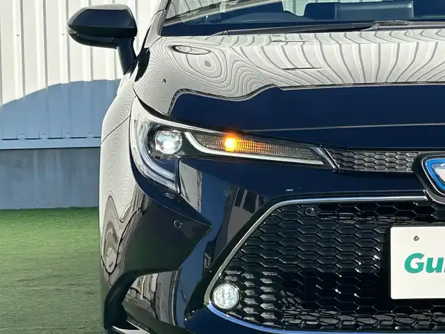 トヨタ カローラツーリング ハイブリッド ダブルバイビー 香川県 2020(令2)年 3.8万km スパークリングブラックパールクリスタルシャイン トヨタセーフティーセンス/・レーダークルーズコントロール/・プリクラッシュセーフティー/・レーントレーシングアシスト/・オートマチックハイビーム/・レーンディパーチャーアラート/純正9インチディスプレイオーディオ/→AM/FM/Bluetooth/地図機能有/バックカメラ/ハーフレザーシート/シートヒーター/エアーシート/革巻きステアリング/ステアリングヒーター/ステアリングリモコン/前後ドライブレコーダー/オートホールド/LEDヘッドライト/コーナーセンサー/ブラインドスポットモニター/純正アルミホイール17インチ/純正フロアマット/ドアバイザー/ETC/プッシュスタート/スマートキー