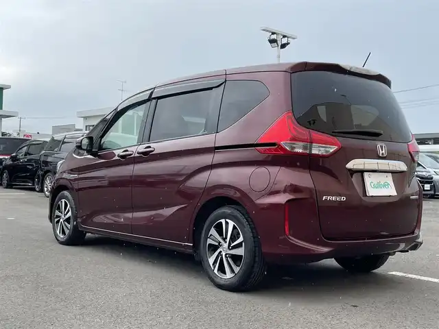 ホンダ フリード ハイブリット EX 東京都 2017(平29)年 6.6万km プレミアムディープロッソパール 純正９型ナビ　/純正１１型後席モニター　/両側電動　/前後ドラレコ　/ビルトインＥＴＣ　/前席シートヒーター　/追従クルコン　/フルセグＴＶ　/Ｂｌｕｅｔｏｏｔｈ　/純正１５インチＡＷ　/寒冷地仕様　/衝突被害軽減