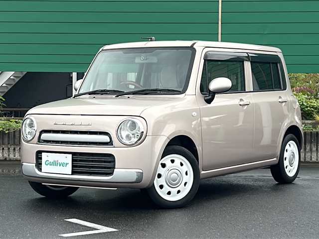 スズキ ラパン ショコラ G 茨城県 2014(平26)年 4.5万km シャンパンピンクPM 社外7インチナビ/Bluetooth/TV/iPod/バックカメラ/ETC/前後ドライブレコーダー/レザーシート/スマートキー/プッシュスタート/盗難防止装置/HIDオートライト/アイドリングストップ/純正アルミホイール/スペアキー