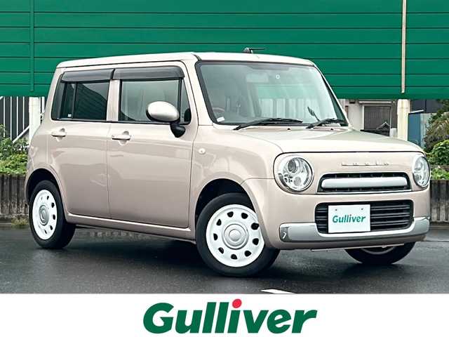 スズキ ラパン ショコラ G 茨城県 2014(平26)年 4.5万km シャンパンピンクPM 社外7インチナビ/Bluetooth/TV/iPod/バックカメラ/ETC/前後ドライブレコーダー/レザーシート/スマートキー/プッシュスタート/盗難防止装置/HIDオートライト/アイドリングストップ/純正アルミホイール/スペアキー