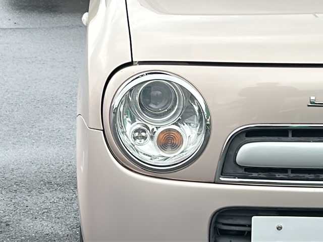 スズキ ラパン ショコラ G 茨城県 2014(平26)年 4.5万km シャンパンピンクPM 社外7インチナビ/Bluetooth/TV/iPod/バックカメラ/ETC/前後ドライブレコーダー/レザーシート/スマートキー/プッシュスタート/盗難防止装置/HIDオートライト/アイドリングストップ/純正アルミホイール/スペアキー