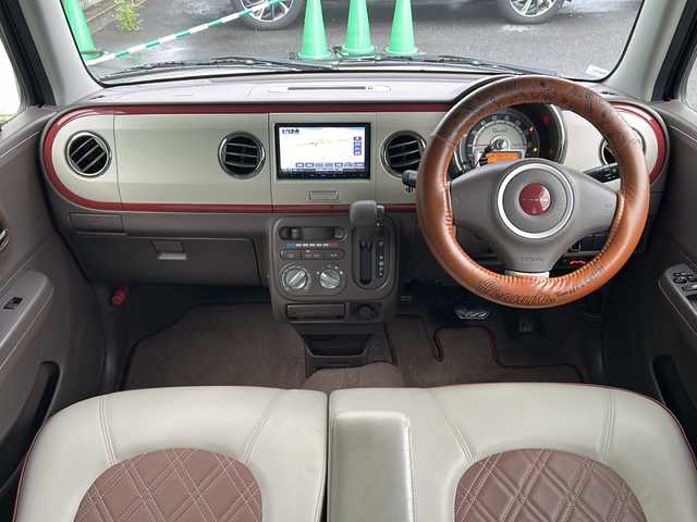 スズキ ラパン ショコラ G 茨城県 2014(平26)年 4.5万km シャンパンピンクPM 社外7インチナビ/Bluetooth/TV/iPod/バックカメラ/ETC/前後ドライブレコーダー/レザーシート/スマートキー/プッシュスタート/盗難防止装置/HIDオートライト/アイドリングストップ/純正アルミホイール/スペアキー