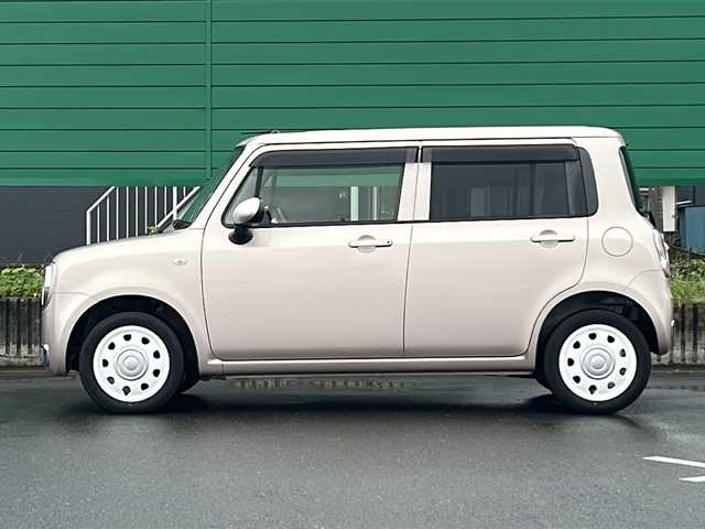 スズキ ラパン ショコラ G 茨城県 2014(平26)年 4.5万km シャンパンピンクPM 社外7インチナビ/Bluetooth/TV/iPod/バックカメラ/ETC/前後ドライブレコーダー/レザーシート/スマートキー/プッシュスタート/盗難防止装置/HIDオートライト/アイドリングストップ/純正アルミホイール/スペアキー