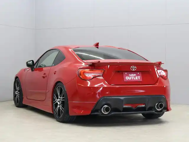トヨタ ８６ GT 三重県 2013(平25)年 6.2万km ライトニングレッド MODELLISTAフロントスポイラー/MODELLISTAサイドスカート/MODELLISTAリヤスパッツ/純正リヤスポイラー/MODELLISTA WingDancer II18インチAW/HKSマフラー/BLITZアドバンスパワーエアクリーナー/BLITZ車高調整式ダンパー/社外LEDヘッドランプ・テールランプ/ILLINIUM FLUXシフトノブ/CNSPEEDステアリング/純正HDDナビ・地デジTV/・DVD/CD/・Bluetooth/バックカメラ/革/アルカンターラコンビシート/シートヒーター(前席)/ETC/プッシュエンジンスタート/スマートキー×2