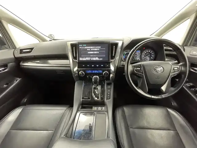 トヨタ ヴェルファイア ハイブリット ZR Gエディション 熊本県 2018(平30)年 7.7万km ブラック 純正１０インチナビ（ＣＤ・ＤＶＤ・フルセグ・ＢＴ・ＳＤ）/バックカメラ　/純正10インチフリップダウンモニター　/ビルトインＥＴＣ２．０　/両側パワースライドドア　/前後クリアランスソナー　/エアロ　（フロント、サイド、リア）/パワーバックドア/トヨタセーフティーセンス/・プリクラッシュセーフティ/・レーンディパーチャーアラート/・オートマチックハイビーム/・レーダークルーズコントロール/前席シートヒーター/シートベンチレーション/２列目シートヒーター/ステアリングヒーター/前席パワーシート/黒本革シート/純正フロアマット/LEONIS１７インチAW/オートライト/３眼LEDヘッドライト/スマートキー/プッシュスタート/スペアキー1本