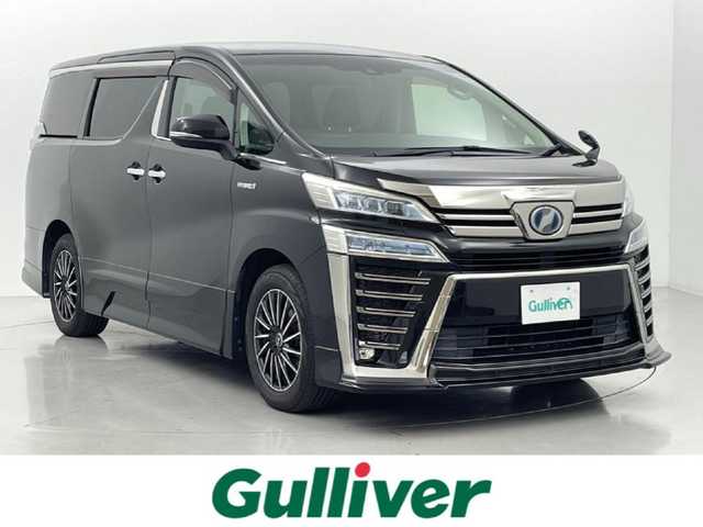 トヨタ ヴェルファイア ハイブリット ZR Gエディション 熊本県 2018(平30)年 7.7万km ブラック 純正１０インチナビ（ＣＤ・ＤＶＤ・フルセグ・ＢＴ・ＳＤ）/バックカメラ　/純正10インチフリップダウンモニター　/ビルトインＥＴＣ２．０　/両側パワースライドドア　/前後クリアランスソナー　/エアロ　（フロント、サイド、リア）/パワーバックドア/トヨタセーフティーセンス/・プリクラッシュセーフティ/・レーンディパーチャーアラート/・オートマチックハイビーム/・レーダークルーズコントロール/前席シートヒーター/シートベンチレーション/２列目シートヒーター/ステアリングヒーター/前席パワーシート/黒本革シート/純正フロアマット/LEONIS１７インチAW/オートライト/３眼LEDヘッドライト/スマートキー/プッシュスタート/スペアキー1本
