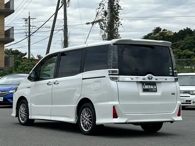 トヨタ ヴォクシー ハイブリッド ZS 煌Ⅱ 福岡県 2020(令2)年 5.5万km ホワイトパールクリスタルシャイン ワンオーナー/純正ナビ/純正12.1型後席フリップダウンモニター/バックカメラ/クルーズコントロール/フルセグ/BT/CD/DVD/両側パワースライドドア/オートエアコン（左右独立温度調整）/シートヒーター（D/N席）/トヨタセーフティセンス/（プリクラッシュセーフティ/レーンディパーチャーアラート/オートマチックハイビーム）/パーキングサポートブレーキ