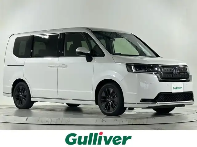 ホンダ ステップワゴン スパーダ eHEV 佐賀県 2025(令7)年 0.1千km プラチナホワイトパール 登録済未使用車/純正11.4インチホンダコネクトナビ/CD/DVD/フルセグTV/Bluetooth/両側パワースライドドア/バックカメラ/ホンダセンシング/衝突軽減ブレーキ/レーンキープアシスト/コーナーセンサー/横滑り防止/オットマン/パドルシフト/スマートキー/スペアキー/純正１６インチアルミホイール/LEDヘッドライト/三点エアバック