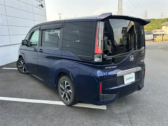 ホンダ ステップワゴン スパーダ ホンダセンシング 長崎県 2018(平30)年 10.6万km オブシダンブルーパール 純正9インチナビ/（CD/DVD/BT/フルセグ）/バックカメラ/フリップダウンモニター/衝突軽減システム/レーンアシスト/レーダークルーズ/ETC/両側パワースライドドア/パドルシフト/オートライト/純正16インチAW