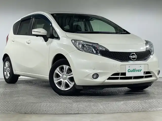 日産 ノート X DIG－S Vセレ +セーフ 神奈川県 2015(平27)年 6.4万km ブリリアントホワイトパール 純正7型SDナビゲーション【MP314D-W】/AM FM フルセグ Bluetooth CD DVD SD AUX/アラウンドビューモニター/エマージェンシーブレーキ/レーンキープアシスト/アイドリングストップ/前後ドライブレコーダー/ETC/ステアリングリモコン/LEDヘッドライト/オートライト/フォグランプ/シートリフター/純正フロアマット/ドアバイザー