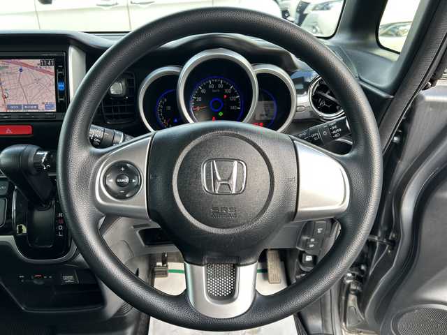 ホンダ Ｎ ＢＯＸ カスタム G Lパッケージ 大阪府 2016(平28)年 5.1万km ポリッシュドメタルメタリック 純正ナビ(BT/CD/DVD/SD/USB/フルセグ)/バックカメラ/衝突被害軽減システム/オートライト/純正アルミホイール/純正フロアマット/片側パワースライドドア/ドライブレコーダー/ビルトインETC/フルフラットシート/チップアップシート/スペアキー×1/カーテンエアバック/HIDヘッドライト