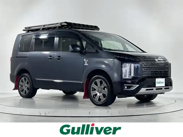 三菱 デリカＤ：５ ジャスパー 佐賀県 2022(令4)年 5.1万km グラファイトグレーメタリック/ブラックマイカ アルパイン製11インチナビ/フルセグTV/CD/DVD/Bluetooth/アルパイン製10インチフリップダウンモニター/全方位バックカメラ/レーダークルーズコントロール/オートマチックハイビーム/オートライト/衝突軽減ブレーキ/車線逸脱防止警報/誤発進抑制機能/ブライドスポットモニター/前方ドライブレコーダー/オートホールドブレーキ/ビルトイETC/両側パワースライドドア/ルーフキャリア/LED ヘッドライト/パドルシフト/ハーフレザーシフト/純正18インチアルミホイール