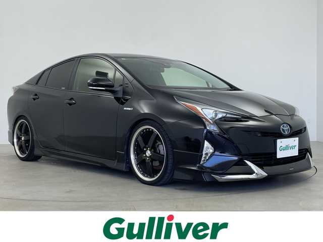 トヨタ プリウス Sセーフティプラス 鹿児島県 2017(平29)年 14.6万km アティチュードブラックマイカ TEIN車高調/純正型ナビ/（フルセグＴＶ/Bluetooth)/HDMI/シートヒーター/バックカメラ/ヘッドアップディスプレイ/ＥＴＣ/セーフティセンス/シートカバー/衝突軽減/レーダークルーズコントロール/ＬＥＤヘッドライト/社外19インチアルミホイール/オートライト/フォグランプ/保証書/取扱説明書