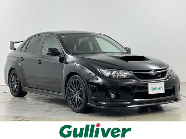 スバル インプレッサ ＷＲＸ STi 道央・札幌 2012(平24)年 7.2万km オブシディアンブラックパール ・4WD/ターボ/6MT/・STiマフラー/純正リアスポイラー/・Defuブーストメーター/・社外7インチメモリナビ（AVIC-RZ702）/・BT/CD/DVD/SD/フルセグTV/・バックカメラ/・ハーフレザーシート/D席パワーシート/・HIDヘッドライト/・フロント/リヤフォグランプ/・ライトレベライザー/・プッシュスタート/スマートキー×2/・社外前後ドラレコ（ZDR-018）/・ETC/・STiホイール付冬タイヤ積込