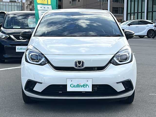 ホンダ フィット e:HEVホーム カーサ 長野県 2022(令4)年 4.3万km プラチナホワイトパール ホンダセンシング/・衝突軽減ブレーキ/・歩行者事故低減ステアリング/・路外逸脱抑制機能/・アダプティブクルーズコントロール/・車線維持支援システム/・先行車発進お知らせ機能/・オートハイビーム/・標識認識機能/Casa専用シート/純正9インチナビ【VXU-215FTi】/(CD/DVD/フルセグTV/BT)/バックカメラ/ビルトインETC/ドライブレコーダー（F・R）/ハーフレザーシート/シートヒーター（D・N席）/革巻きステアリング/ステアリングスイッチ/電動パーキングブレーキ/ブレーキホールド/LEDヘッドライト/オートライト/スマートキー/Pスタート/電動格納ミラー/Casa純正フロアマット/純正16インチAW
