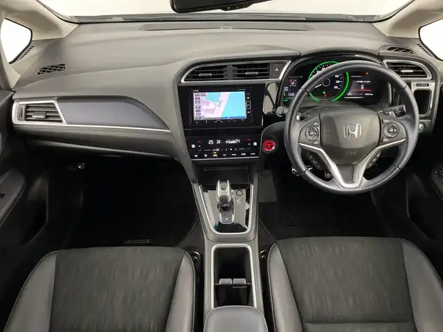 ホンダ シャトル ハイブリッド X ホンダセンシング 鹿児島県 2019(令1)年 5万km クリスタルブラックパール 純正SDナビ/（AM/FM/CD/DVD/Bluetooth/フルセグ）/バックカメラ/ホンダセンシング/レーダークルーズコントロール/レーンキープアシスト/衝突被害軽減ブレーキ/シートヒーター/ETC/ステアリングリモコン/前後ドライブレコーダー/純正フロアマット/スマートキー/プッシュスタート/オートエアコン/オートライト/LEDヘッドライト