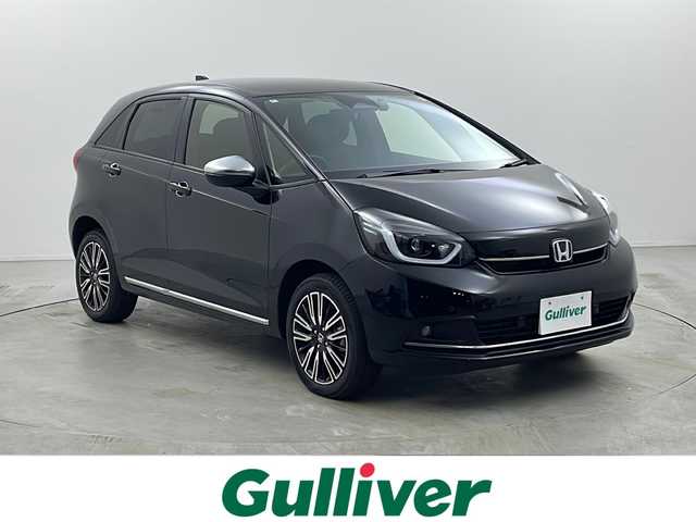 ホンダ フィット e:HEVリュクス 栃木県 2024(令6)年 1.7万km クリスタルブラックパール ワンオーナー/純正ナビ/フルセグTV/AM/FM/Bluetooth/iPod/AUX/USB/バックカメラ/ホンダセンシング/CMBS（衝突軽減ブレーキ）/ACC（オートクルーズコントロール）/先行車発進お知らせ/路外逸脱抑制システム/レーンキープアシスト/標識認識機能/ETC/スマートキー/前後ドライブレコーダー/純正フロアマット/純正16インチAW/LEDヘッドライト/オートハイビーム/置くだけ充電/ハンドルヒーター/シートヒーター/保証書/取扱説明書/スペアキー