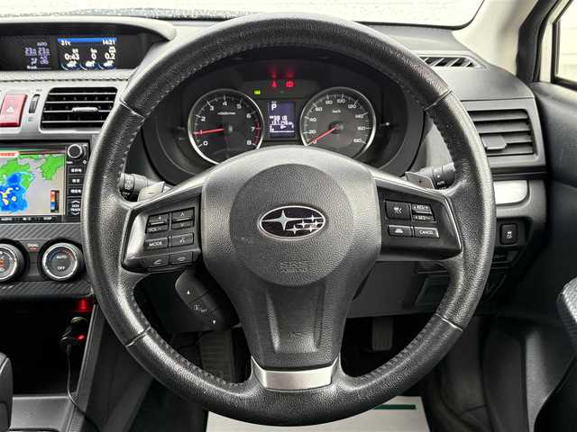 スバル インプレッサ スポーツ 2．0i アイサイト 岩手県 2013(平25)年 13.7万km サテンホワイトパール 禁煙車/4WD/追従型クルーズコントロール/純正ナビ/→ワンセグTV/Bluetooth/CD/DVD/FM/AM/バックカメラ/ステアリングスイッチ/衝突軽減ブレーキ/レーンキープアシスト/横滑り防止装置/オートライト/フォグライト/〇プッシュスタート/〇電動格納ミラー/〇ウィンカーミラー/〇ドアバイザー/〇フロアマット/〇パドルシフト/〇スマートキー/デジタルインナーミラー/ETC2.0/冬タイヤ純正アルミホイール車載