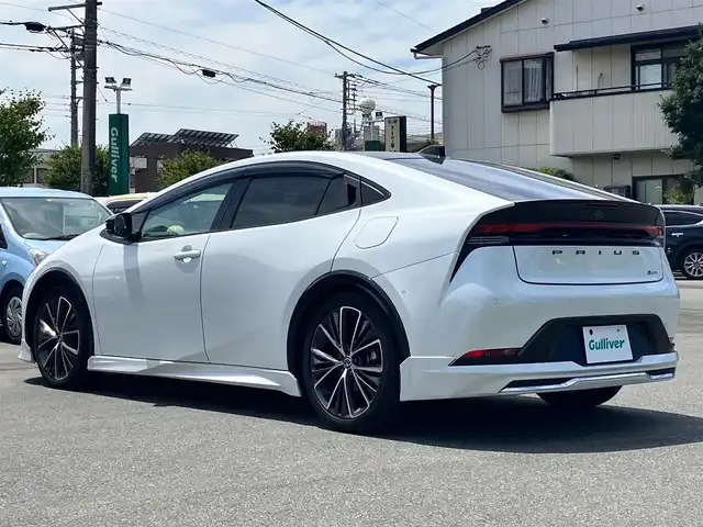 トヨタ プリウス Z 熊本県 2023(令5)年 3.7万km プラチナホワイトパールマイカ エンジンスタートボタン/パワーステアリング/パワーウィンドウ/ワンオーナー/保証書/取扱説明書/１００V充電/パーキングアシスト/アイドリングストップ/スマートキー/スペアキー１本/オートエアコン/クルーズコントロール/USB入力端子/ETC2.0/全方位カメラ/純正12.3インチナビ（BT/フルセグ）/ツインガラスルーフ/電動リアゲート/純正フロアマット/純正アルミホイール/D席パワーシート/D席N席シートヒーター/D席N席エアシート/モデリスタフルエアロ/ABS/横滑り防止装置/コーナーセンサー前後/レーンキープアシスト/オートライト/オートマチックハイビーム/LEDヘッドライト/W＋サイドエアバック/衝突軽減システム/ステアリングヒーター/ワイヤレス充電/BSM/デジタルインナーミラー/トランクトレイ