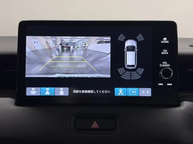 ホンダ ヴェゼル ハイブリッド e:HEV Z 三重県 2025(令7)年 0.1千km プラチナホワイトパール ハイブリッド/FF/MTモード付フロアCVT/純正 9インチナビ/（FM/AM/USB/Bluetooth/CarPlay/AndroidAuto/TV）/バックカメラ/ビルトイン ETC2.0/Honda SENSING/・衝突軽減ブレーキ/・先行車発進お知らせ機能/・路外逸脱抑制機能/・標識認識機能/・渋滞追従機能付アダプティブクルーズコントロール（ACC）/・車線維持支援システム（LKAS）/・トラフィックジャムアシスト（渋滞運転支援機能）/・ブラインドスポットインフォメーション/・誤発進抑制機能/・後方誤発進抑制機能/・近距離衝突軽減ブレーキ/・パーキングセンサーシステム/・【OP】後退出庫サポート/・アダプティブドライビングビーム/装備/・ハンズフリーアクセスパワーテールゲート（電動バックドア）/・ハーフレザーシート/・シートヒーター（D/N）/・ステアリングヒーター/・オートライトシステム/・LEDヘッドライト/・LEDフロントフォグランプ/・ヒルディセントコントロール/・左右独立オートエアコン/・自動防眩ルームミラー/・【OP】ワイヤレス充電器/・プッシュスタート/・純正18inAW/・保/取/・スマートキーx2/など