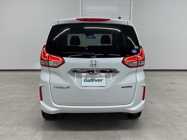 ホンダ フリード＋ ハイブリット G ホンダセンシング 熊本県 2020(令2)年 11.3万km プラチナホワイトパール 純正Gathersインターナビゲーション/【フルセグTV/Bluetooth/CD/DVD/USB】/バックカメラ/ホンダセンシング【安全運転支援システム】/・CMBS【衝突軽減ブレーキ】/・歩行者事故低減ステアリング/・アダプティブクルーズコントロール/・路外逸脱抑制機能/・誤発進抑制機能/・先行車発進お知らせ機能/・標識認識機能/両側パワースライドドア/LEDヘッドランプ/オートライト/アクティブコーナーリングランプ/コンフォートビューパッケージ/SRSエアバック【運転席/助手席】/シートヒーター/ロールサンシェード【スライドドア】/スマートキーシステム/ETC/社外デジタルインナーミラー