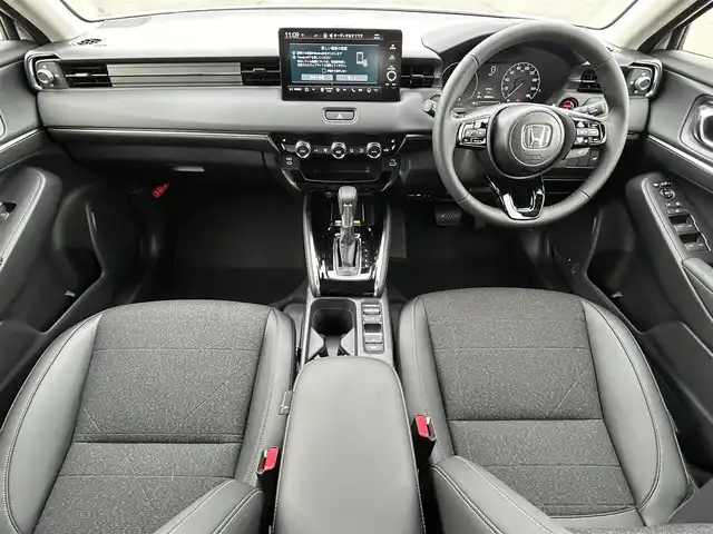 ホンダ ヴェゼル ハイブリッド e:HEV Z 岡山県 2025(令7)年 0.1千km プラチナホワイトパール 登録時走行距離3km/登録済未使用車/純正9インチナビ/フルセグTV(AM.FM.TV.BT)/バックカメラ/ビルトインETC2.0/ブラインドスポットモニター/シートヒーター/ステアリングヒーター/クリアランスソナー/衝突軽減ブレーキ/レーダークルーズコントロール/レーンキープアシスト/ダウンヒルアシストコントロール/横滑り防止装置/オートライト/アイドリングストップ/パワーバックドア/ワイヤレス充電/18インチ純正AW