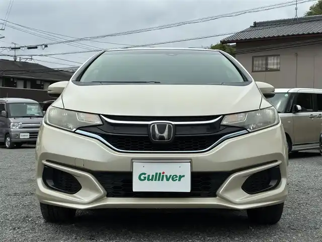 ホンダ フィット ハイブリット Fコンフォートエディション 熊本県 2018(平30)年 13.6万km プレミアムアイボリーP 純正メモリナビ(VXM-184VFi)/【フルセグTV/SD/CD/DVD/Bluetooth/USB】/バックカメラ/衝突被害軽減システム/レーダークルーズコントロール/レーンキープアシスト/前席シートヒーター/ビルトインETC/横滑り防止装置/盗難防止装置/純正フロアマット/ベンチシート/プッシュスタート/スマートキー/取扱説明書/保証書