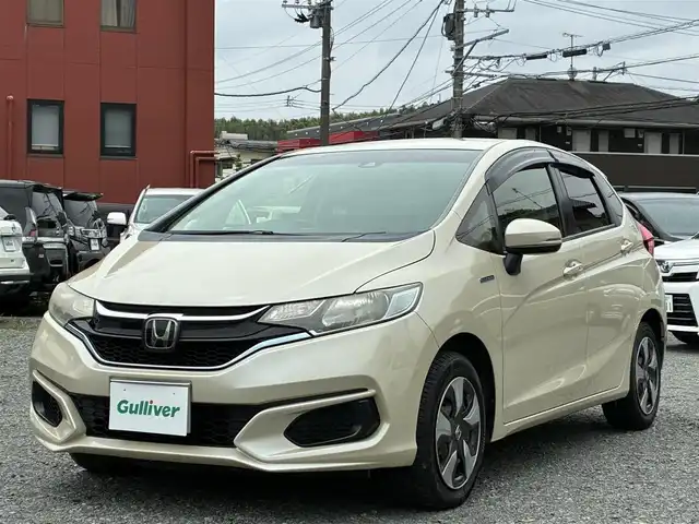 ホンダ フィット ハイブリット Fコンフォートエディション 熊本県 2018(平30)年 13.6万km プレミアムアイボリーP 純正メモリナビ(VXM-184VFi)/【フルセグTV/SD/CD/DVD/Bluetooth/USB】/バックカメラ/衝突被害軽減システム/レーダークルーズコントロール/レーンキープアシスト/前席シートヒーター/ビルトインETC/横滑り防止装置/盗難防止装置/純正フロアマット/ベンチシート/プッシュスタート/スマートキー/取扱説明書/保証書