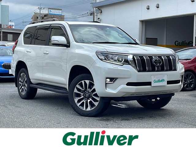 トヨタ ランドクルーザー プラド TX Lパッケージ 福岡県 2022(令4)年 1万km ホワイトパールクリスタルシャイン 禁煙車/ワンオーナー/純正ナビ/トヨタセーフティセンス/クルーズコントロール/横滑り防止/盗難防止/レーンキープアシスト/コーナーセンサー/全方位カメラ/エアバッグ/カーテンエアバッグ/前後ドライブレコーダー/純正アルミホイール/エアロパーツ/プッシュスタート/スマートキー/オートライト/LEDヘッドライト/パワーシート/サンルーフ/電動格納サードシート/４WD/シートクーラー/シートヒーター/ルーフレール/USB