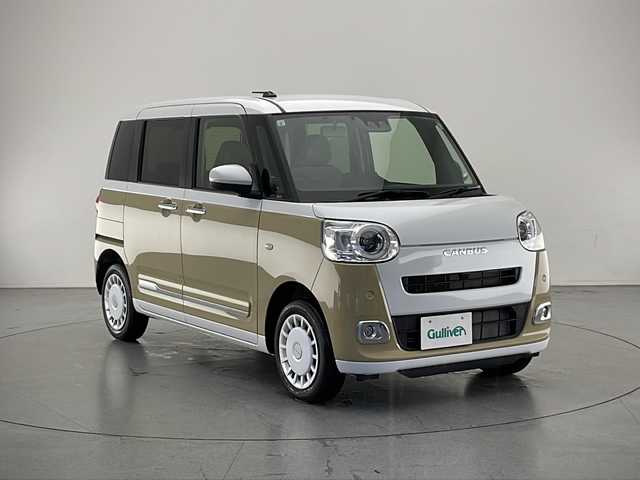 ダイハツ ムーヴ キャンバス ストライプス G 長野県 2023(令5)年 0.8万km シャイニングホワイトパール/サンドベージュメタリック 4WD/純正メモリナビ&フルセグTV&CD&DVD&USB&BT/車線逸脱警報/衝突軽減ブレーキ/後方コーナーセンサー/アイドリングストップ/両側パワースライドドア/前席シートヒーター/ステアリングスイッチ/ベンチシート/バックカメラ/ETC/LEDヘッドライト/オートライト/フロントフォグランプ/電動格納ミラー/電動ホールド/オートホールド/純正ホイールキャップ装着/純正フロアマット/プッシュスタート/スマートキー