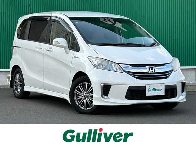 ホンダ フリード ハイブリット ジャストセレクション 宮城県 2014(平26)年 12.7万km プラチナムホワイトパール 純正ナビ/(フルセグTV/CD/DVD/SD/BT)/バックカメラ/フリップダウンモニター/ビルトインETC/クルーズコントロール/レザー調シートカバー/オートエアコン/革巻きステアリング/ステアリングスイッチ/両側パワースライドドア/スマートキー/スペアキー/ウインカー付き電動格納ミラー/ドアバイザー/HIDヘッドライト/純正フロアマット/社外15インチAW