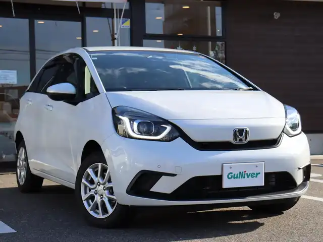 ホンダ フィット ホーム 福島県 2020(令2)年 2.2万km プラチナホワイトパール  4     W     D/ 純 正 ナ ビ・フ ル セ グ T V/ 純 正 バ ッ ク カ メ ラ/ ド ラ イ ブ レ コ ー ダ ー (F・R)/ レ ー ダ ー ク  ル ー ズ コ ン ト ロ ー ル/ ス マ ー ト キ ー/ E      T      C/ フ ロ ン ト ガ ラ ス 熱 線/ ア イ ド リ ン グ ス ト ッ プ/ モデューロ１５インチアルミ/ 新　車　保　証　書