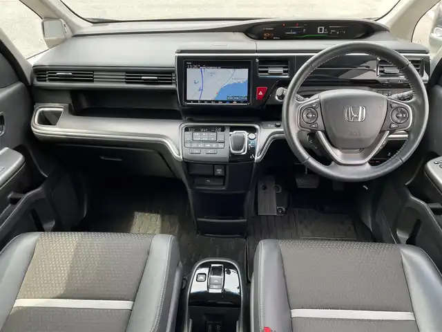 ホンダ ステップワゴン スパーダ eHEV G EXホンダS 島根県 2021(令3)年 5.3万km プレミアムスパークルブラックパール ホンダセンシング/純正9インチナビ/（フルセグTV/Bluetooth/FM/AM/CD/DVD）/バックカメラ/アダプティブクルーズコントロール/両側パワースライドドア/ビルトインETC/前後ドライブレコーダー/パドルシフト/ドアバイザー/コーナーポール/純正フロアマット/わくわくゲート/コンビシート/前席シートヒーター/ロードサインアシスト/プリクラッシュセーフティ/LEDヘッドライト/先行車発進お知らせ機能/オートライト/スマートキー/スペアキー1本/プッシュスタート/保証書/取扱説明書