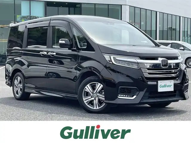 ホンダ ステップワゴン スパーダ eHEV G EXホンダS 島根県 2021(令3)年 5.3万km プレミアムスパークルブラックパール ホンダセンシング/純正9インチナビ/（フルセグTV/Bluetooth/FM/AM/CD/DVD）/バックカメラ/アダプティブクルーズコントロール/両側パワースライドドア/ビルトインETC/前後ドライブレコーダー/パドルシフト/ドアバイザー/コーナーポール/純正フロアマット/わくわくゲート/コンビシート/前席シートヒーター/ロードサインアシスト/プリクラッシュセーフティ/LEDヘッドライト/先行車発進お知らせ機能/オートライト/スマートキー/スペアキー1本/プッシュスタート/保証書/取扱説明書