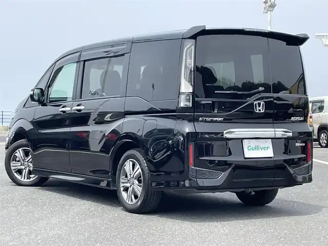 ホンダ ステップワゴン スパーダ eHEV G EXホンダS 島根県 2021(令3)年 5.3万km プレミアムスパークルブラックパール ホンダセンシング/純正9インチナビ/（フルセグTV/Bluetooth/FM/AM/CD/DVD）/バックカメラ/アダプティブクルーズコントロール/両側パワースライドドア/ビルトインETC/前後ドライブレコーダー/パドルシフト/ドアバイザー/コーナーポール/純正フロアマット/わくわくゲート/コンビシート/前席シートヒーター/ロードサインアシスト/プリクラッシュセーフティ/LEDヘッドライト/先行車発進お知らせ機能/オートライト/スマートキー/スペアキー1本/プッシュスタート/保証書/取扱説明書