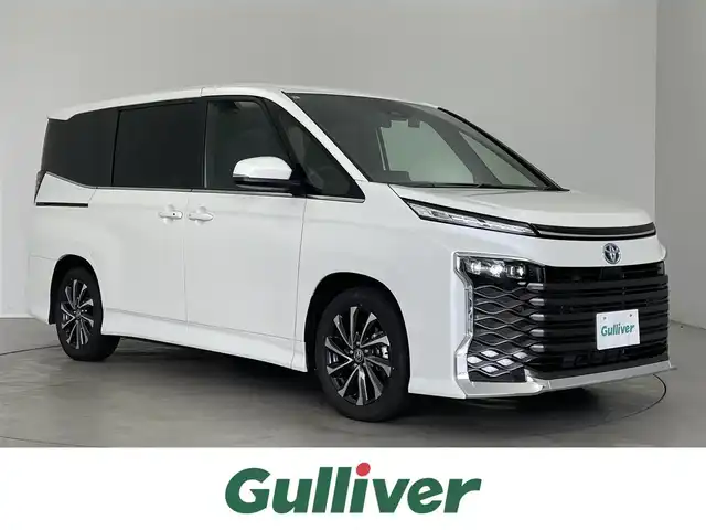 トヨタ ヴォクシー ハイブリッド S－Z 埼玉県 2024(令6)年 0.7万km ホワイトパールクリスタルシャイン 純正１０．５インチディスプレイオーディオナビ　純正１３インチフリップダウンモニター　快適利便　バックカメラ　ビルトインＥＴＣ２．０　ＡＣ１００Ｖ　ＤＶＤ再生　ＨＤＭＩ　三眼ＬＥＤライト　パワーバックドア　社外前後ドライブレコーダー　レーダークルーズコントロール　シートヒーター　純正アルミホイール　地デジフルセグTV スマートキー　オートライト