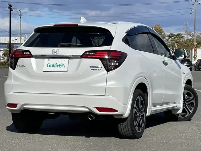 ホンダ ヴェゼル ハイブリッド Z ホンダセンシング 道央・札幌 2020(令2)年 3.5万km プラチナホワイトパール ４WD/ワンオーナー/純正ディーラーOPナビ/CD/DVD/BT/フルセグ/ホンダセンシング/衝突被害軽減ブレーキ/横滑り防止装置/アダプティブクルーズコントロール/レーンキープアシスト/バックカメラ/ビルトインETC/ECONモード/SPORTMODE/ワイパーデアイサー/前席シートヒーター/ハーフレザーシート/革巻きステアリング/ステアリングリモコン/パドルシフト/電動パーキング/ブレーキホールド/プッシュスタート/スマートキー/LEDヘッドライト/オートライト/フォグランプ/電動格納ミラー/ヒーテッドドアミラー/ウィンカーミラー/純正フロアマット/ドアバイザー