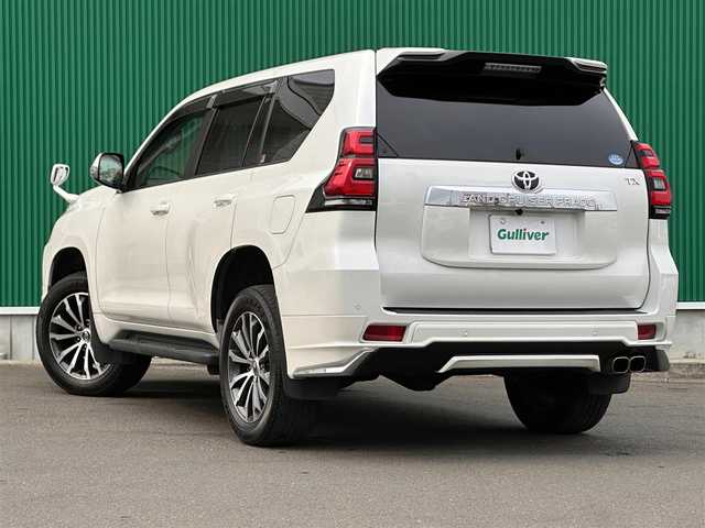 トヨタ ランドクルーザー プラド TX Lパッケージ 鹿児島県 2019(令1)年 4.4万km ホワイトパールクリスタルシャイン サンルーフ/モデリスタエアロ（F/R）/セーフティセンス/・プリクラッシュセーフティ/・レーダークルーズコントロール/・レーンディパーチャーアラート/・オートマチックハイビーム/前後コーナーセンサー/純正9インチナビ（NSZT-Y68T）/・CD/DVD/・Bluetooth/・フルセグTV/バックカメラ/ビルトインETC/本革シート/前席パワーシート/前席シートヒーター/ベンチレーション/革巻きステアリング/ステアリングスイッチ/MTモード付きAT/LEDヘッドライト/フォグライト/オートライト/サイドステップ/スマートキー＆プッシュスタート/ウィンカーミラー/純正19インチAW/純正フロアマット/ドアバイザー/新車保証書/取扱説明書/W/サイド/カーテンエアバッグ
