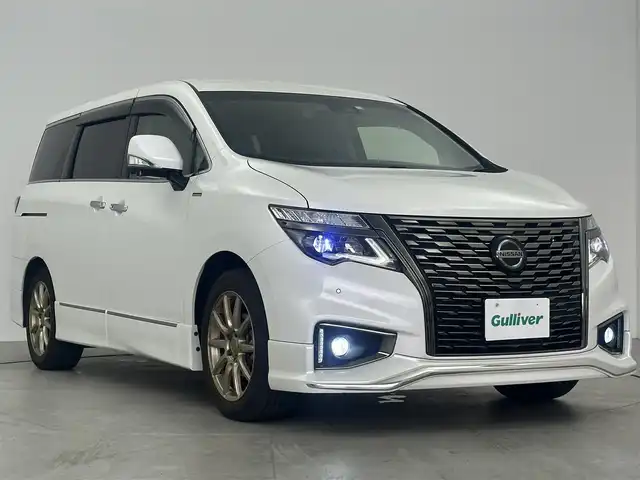 日産 エルグランド 250HWS S アーバンクロム 愛知県 2020(令2)年 2.1万km ピュアホワイトパール 7人乗り/純正10インチディーラーオプションナビ/アラウンドビューモニター/デジタルインナーミラー/ドライブレコーダー（前後）/ビルトインETC/ステアリングスイッチ/日産オリジナルナビゲーション取付パッケージ/　　・USBポート×3/　　・GPSアンテナ/　　・TVアンテナ/　　・TVアンテナ用ハーネス/アルパイン10インチ後席フリップダウンモニター/両側パワースライドドア/パワーバックドア/純正フロアマット/純正エアロパーツ/　　・ルーフスポイラー/　　・バックドアガーニッシュ/純正LEDヘッドライト/フォグランプ/取扱説明書/保証書/スマートキー/スペアキー