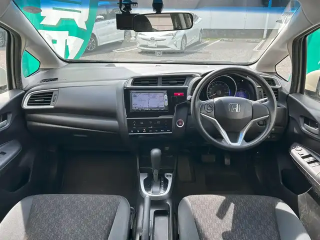 ホンダ フィット 13G Fパッケージ 東京都 2015(平27)年 10.3万km プレミアムホワイトパール 外部検査済み/純正SDナビ（VXM-155VSi）/・Bluetoothオーディオ/TV/DVD/バックカメラ/アイドリングストップ/スマートキー/プッシュスタート/ビルトインETC