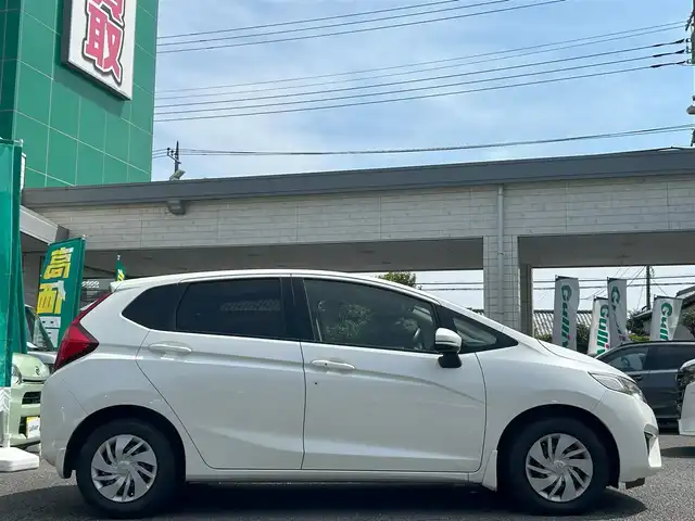 ホンダ フィット 13G Fパッケージ 東京都 2015(平27)年 10.3万km プレミアムホワイトパール 外部検査済み/純正SDナビ（VXM-155VSi）/・Bluetoothオーディオ/TV/DVD/バックカメラ/アイドリングストップ/スマートキー/プッシュスタート/ビルトインETC