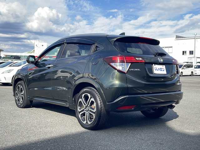 ホンダ ヴェゼル ハイブリッド Z 熊本県 2015(平27)年 9万km ミスティックグリーンパール (株)IDOMが運営する【じしゃロン熊本店】の自社ローン対象車両になります。こちらは現金ご利用時の価格です。自社ローンご希望の方は別途その旨お申付け下さい。/純正ナビ（ＣＤ　ＤＶＤ　フルセグＴＶ　ＢＴ）　/バックカメラ　/クルーズコントロール　/ビルトインＥＴＣ　/ジャズブラウン内装　/シートヒーター　/Ｗ＋サイドエアバッグ　/カーテンエアバッグ　/ルーフレール