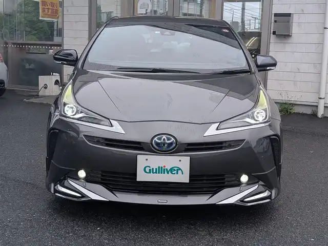 トヨタ プリウス A プレミアム 埼玉県 2020(令2)年 5.6万km グレーメタリック ＜外装＞/モデリスタエアロ(F、S、R)/ローダウン(ダウンサス)/ワーク19インチ アルミホイール/ヘッドライト純正加工品(LED)/マフラーカッター/TRDエアロドアミラーフィン/＜機能＞/エコグライダー(スロットルコントローラー)/ナビキャンセラー/HDMIポート入力端子/ワンタッチウインカー/純正ナビ(フルセグ/Bluetooth/CD/DVD/ラジオ)/シートヒーター/シートベンチレーター/クルーズコントロール(追従機能あり)/HUD(ヘッドアップディスプレイ)/ETC/ドラレコ/＜その他＞/スペアキー×2/純正ホイールあり（15インチ）