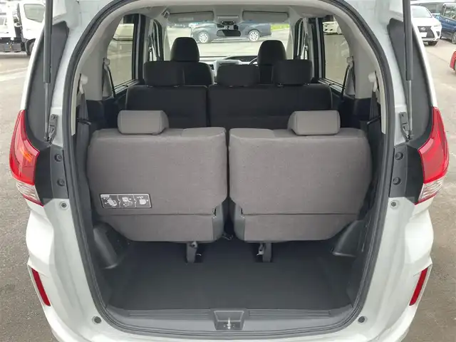 ホンダ フリード G 愛媛県 2023(令5)年 1.5万km プラチナホワイトパール 純正ナビ/AM/FM/CD/DVD/BT/バックカメラ　/両側電動ドア　/ホンダセンシング　/アダプティブクルーズコントロール　/車線逸脱防止装置/衝突被害軽減装置/ステアリングスイッチ　/D/N席シートヒーター　/電格ミラー/ヒートミラー　/ドラレコ　/ETC　/LEDヘッドライト/フロントワイパーデアイサー/現状サマー(鉄)(185/65/R15)