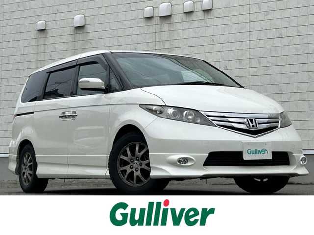 ホンダ エリシオン GエアロHDDナビスマートセレ 山形県 2010(平22)年 10.9万km プレミアムホワイトパール 純正HDDナビ/FM/AM/DVD/CD/ワンセグTV/両側パワースライド/純正16インチAW/盗難防止装置/AUTOライト/キセノンライト/フォグランプ/3列シート/ETC/ダブルエアバック/バックカメラ/チップアップシート/ハーフレーザーシート/純正マット/純正バイザー/夏タイヤ積載/保証書/取扱説明書