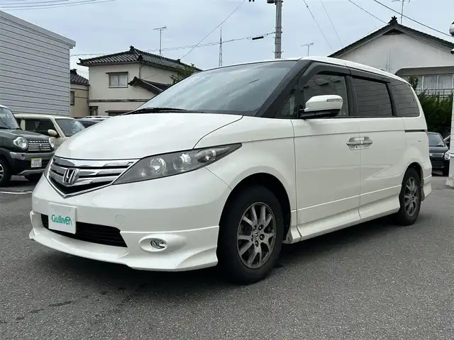 ホンダ エリシオン GエアロHDDナビスマートセレ 山形県 2010(平22)年 10.9万km プレミアムホワイトパール 純正HDDナビ/FM/AM/DVD/CD/ワンセグTV/両側パワースライド/純正16インチAW/盗難防止装置/AUTOライト/キセノンライト/フォグランプ/3列シート/ETC/ダブルエアバック/バックカメラ/チップアップシート/ハーフレーザーシート/純正マット/純正バイザー/夏タイヤ積載/保証書/取扱説明書